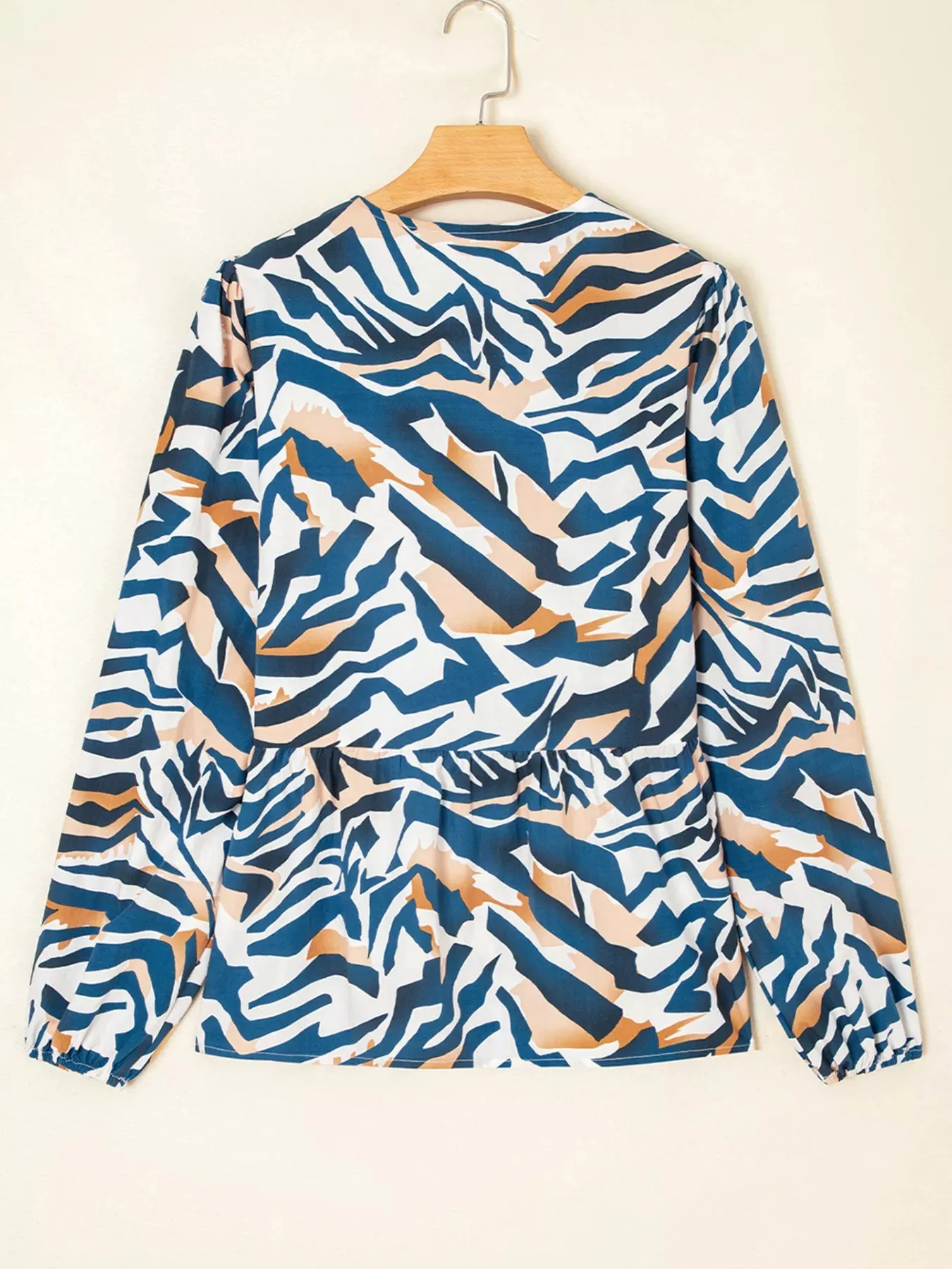 Zebra Print Tied Front Puff Sleeve Top sold by Charming Charlie product image thumbnail 3