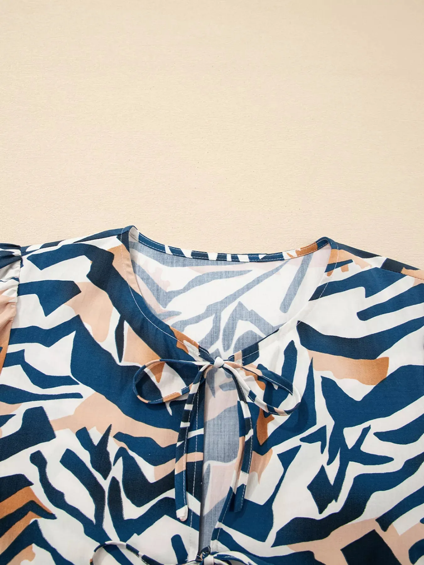 Zebra Print Tied Front Puff Sleeve Top sold by Charming Charlie product image thumbnail 4