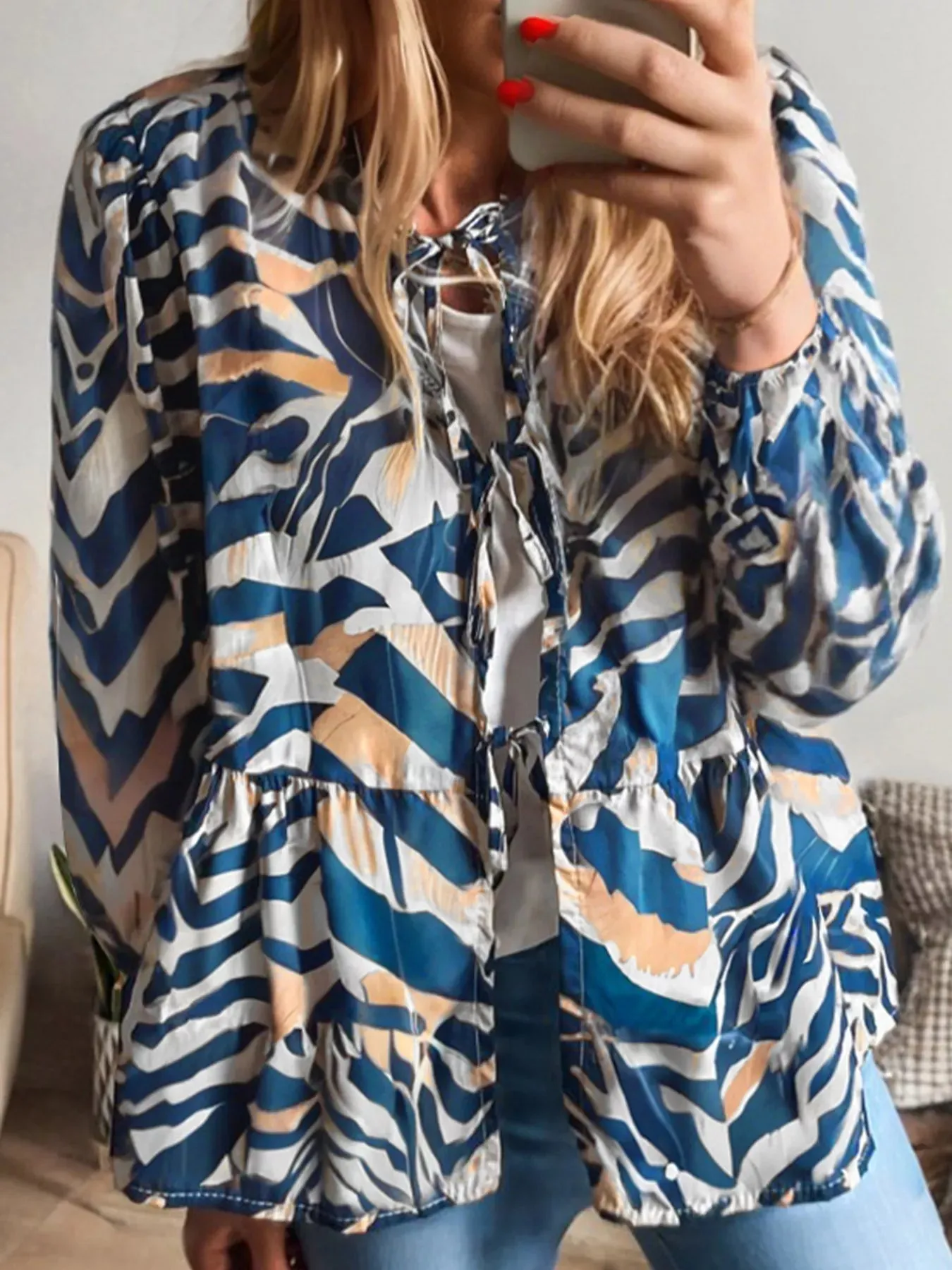 Zebra Print Tied Front Puff Sleeve Top sold by Charming Charlie