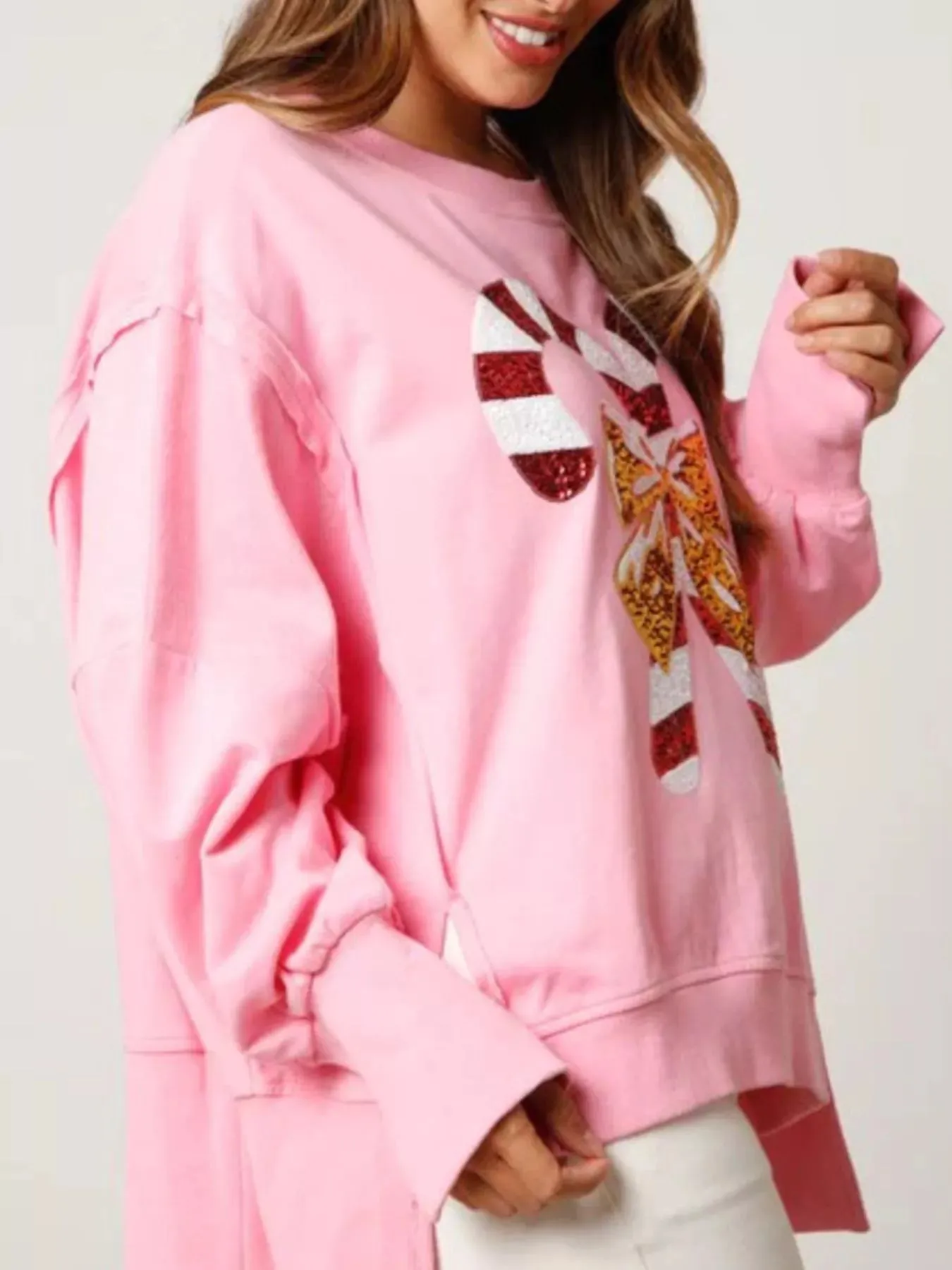 Christmas Candy Cane Bow Dropped Shoulder Sweatshirt sold by Charming Charlie product image thumbnail 3