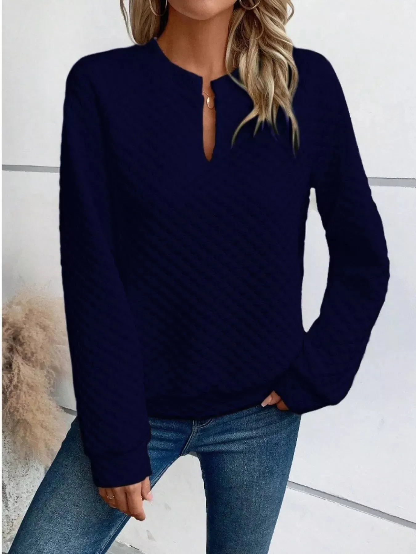Textured Notched Long Sleeve Sweatshirt sold by Charming Charlie