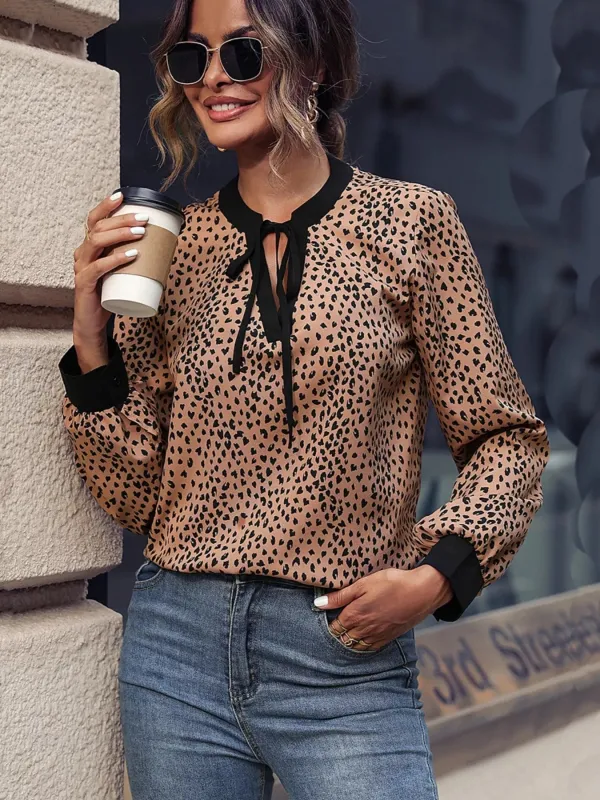 Animal Print Contrast Trim Tie Front Blouse sold by Charming Charlie