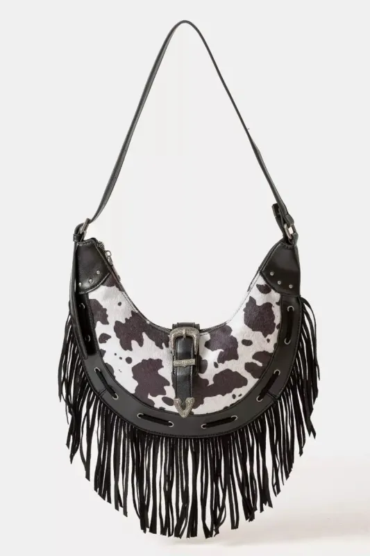 Fame Cow Print Faux Leather Fringe Hobo Bag sold by Charming Charlie
