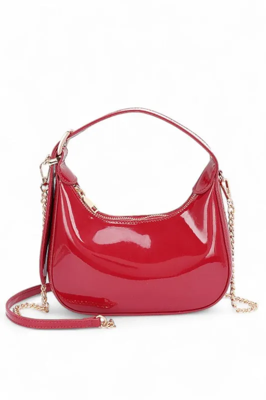 Patent Faux Leather Top Handle Swing Bag sold by Charming Charlie