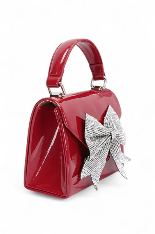 Rhinestone Bow Tie Patent Finish Crossbody Bag sold by Charming Charlie product image thumbnail 4