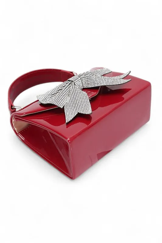 Rhinestone Bow Tie Patent Finish Crossbody Bag sold by Charming Charlie product image thumbnail 5