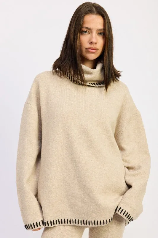 OVERSIZED TURTLE NECK SWEATER WITH STITCHING sold by Charming Charlie