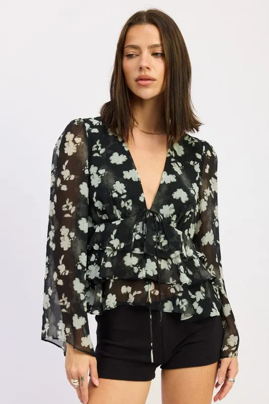 FLORAL TIE FRONT RUFFLED BLOUSE sold by Charming Charlie