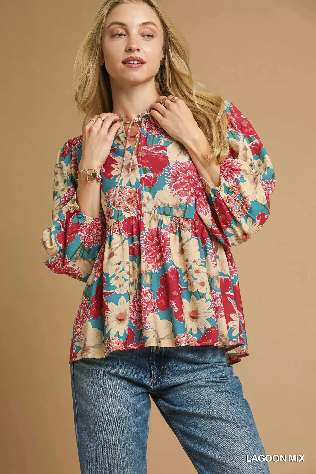 Umgee Mix Floral Peplum Blouse with Tie Neck sold by Charming Charlie