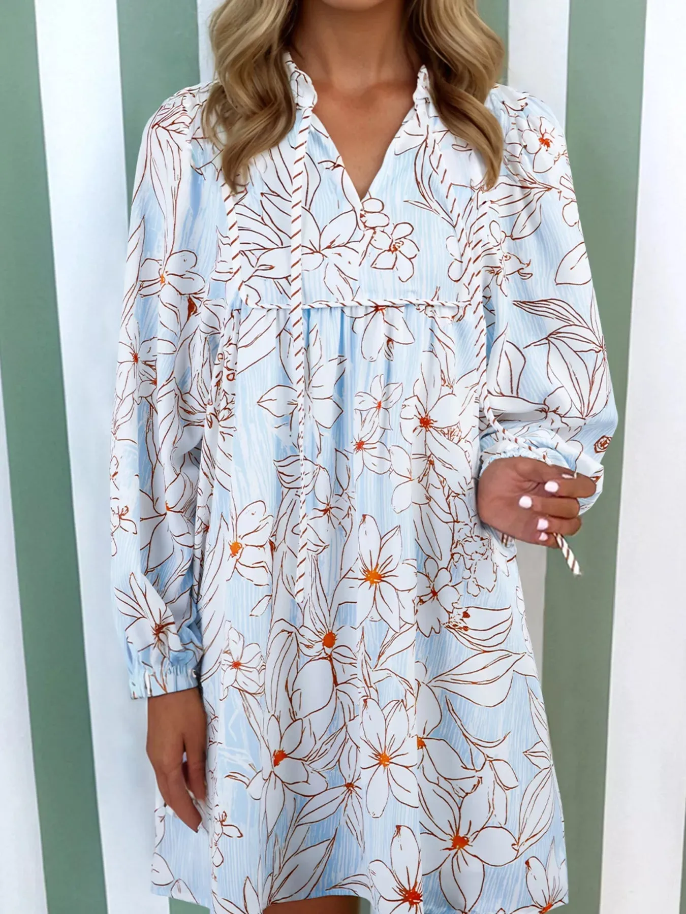 Floral Print Tie Neck Long Sleeve Mini Dress sold by Charming Charlie