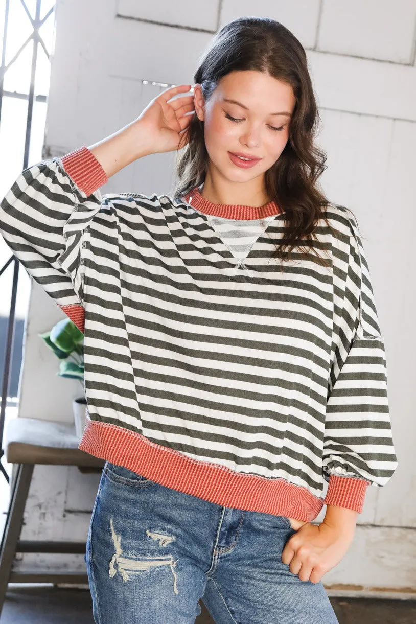 A Stripe Story Rust Crew Neck Pullover sold by Charming Charlie