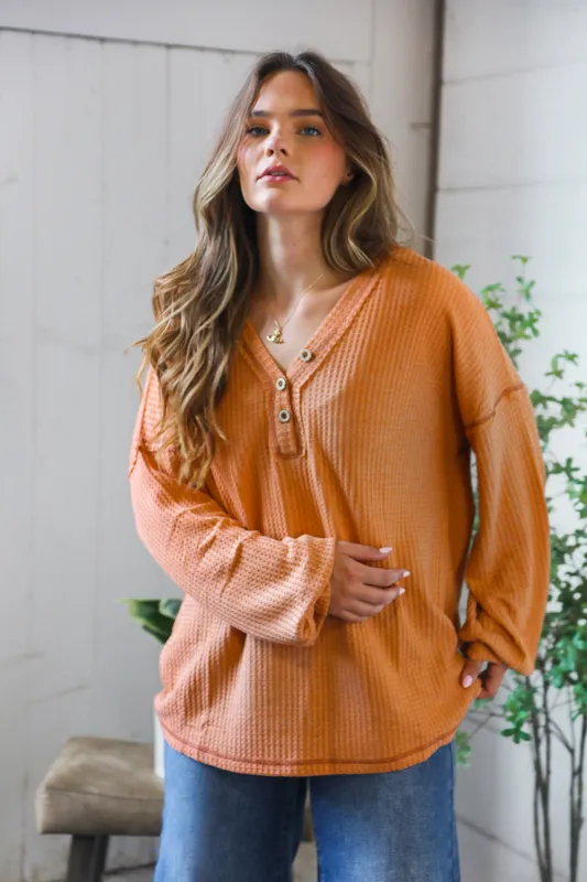 Pumpkin Spice Henley sold by Charming Charlie