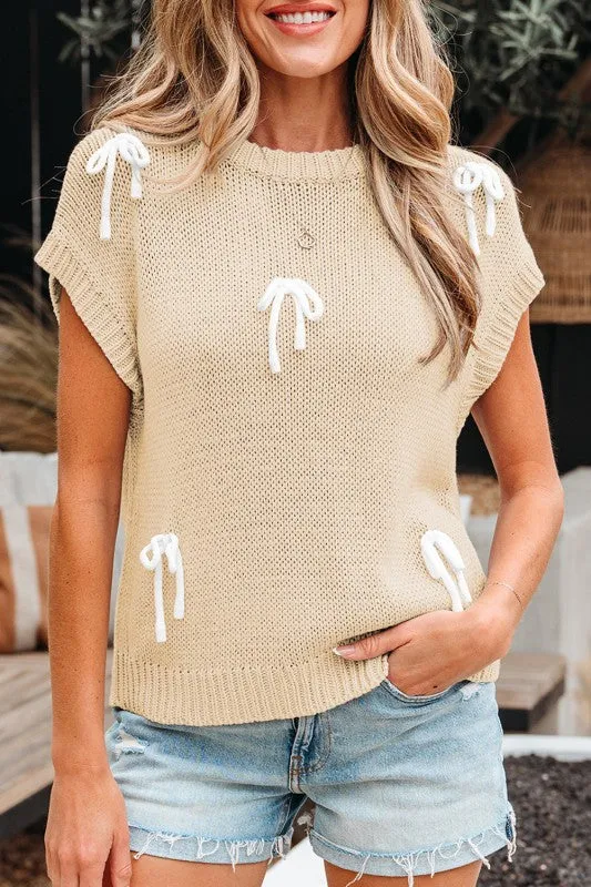 Solid Bow Applique Cap Sleeve Sweater sold by Charming Charlie