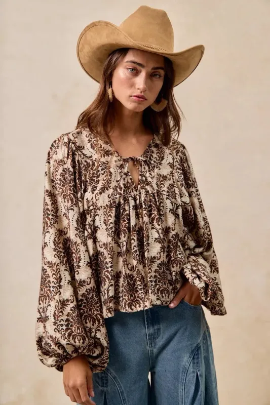 BiBi Printed Woven Front Tied Blouse with Baloon Sleeve sold by Charming Charlie