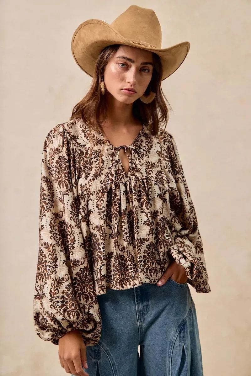 BiBi Printed Woven Front Tied Blouse with Baloon Sleeve sold by Charming Charlie
