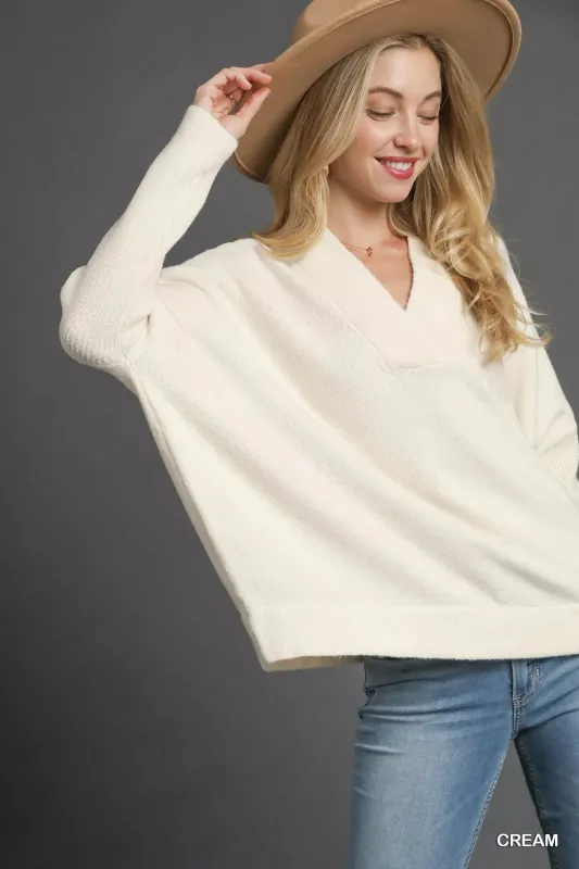 Umgee V-Neck Sweater with Wide Trim Detail sold by Charming Charlie