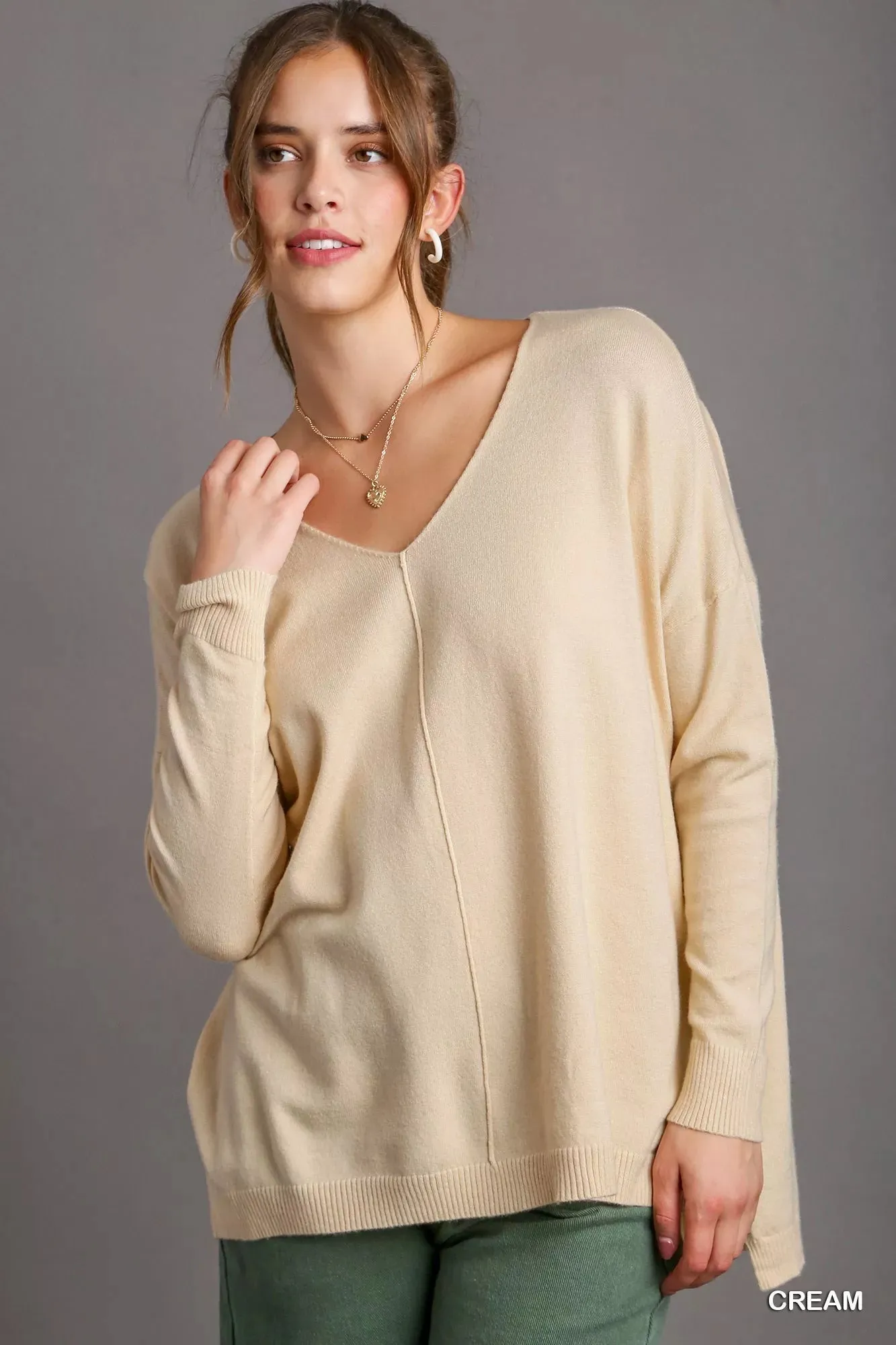 Umgee V-Neck High Low Hem Knit Top with Side Slit sold by Charming Charlie