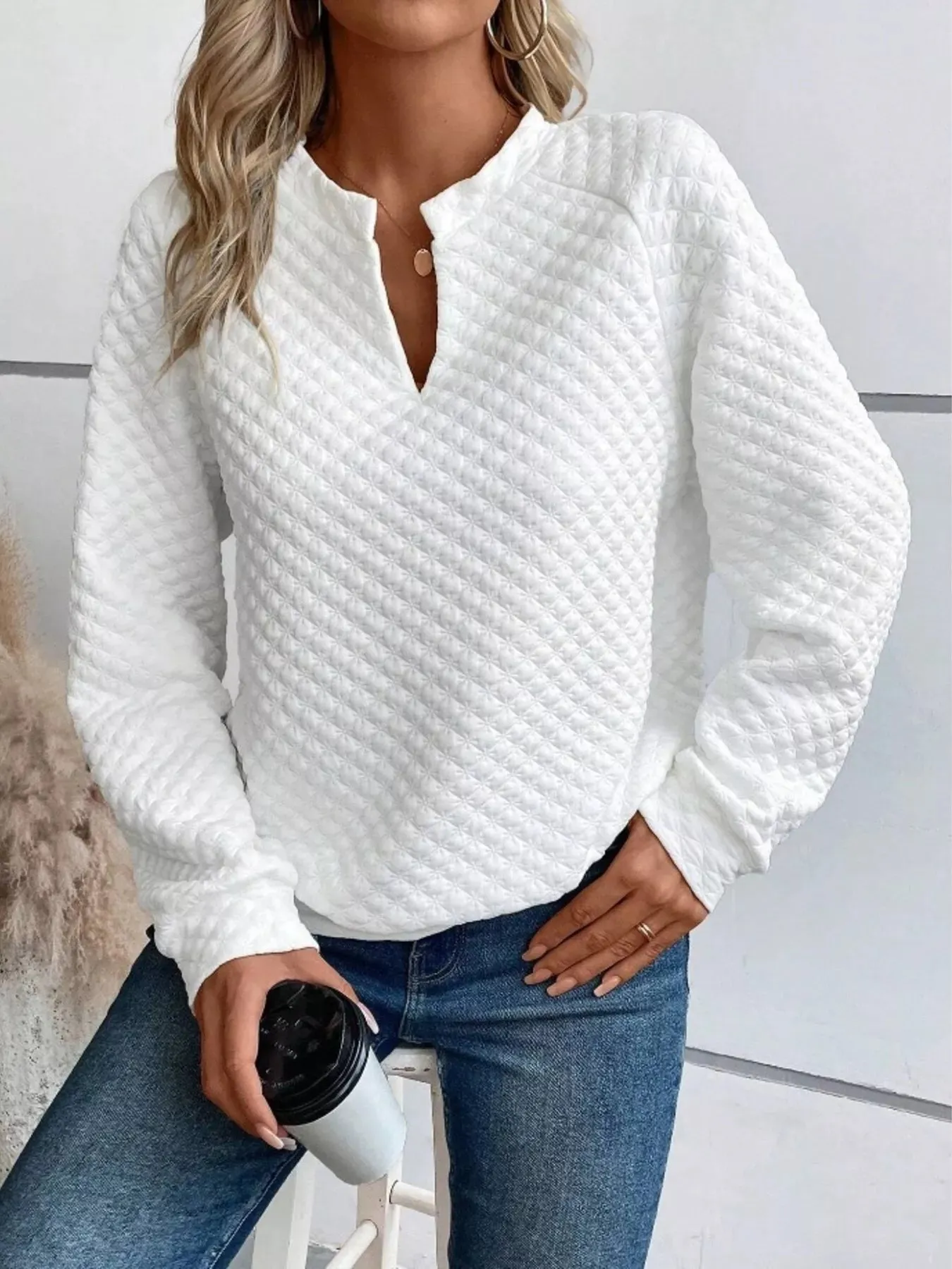 Textured Long Sleeve Notched Sweatshirt sold by Charming Charlie