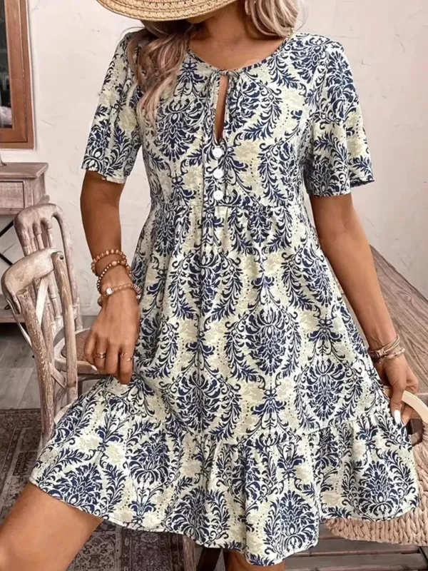 Printed Tie Neck Short Sleeve Mini Dress sold by Charming Charlie