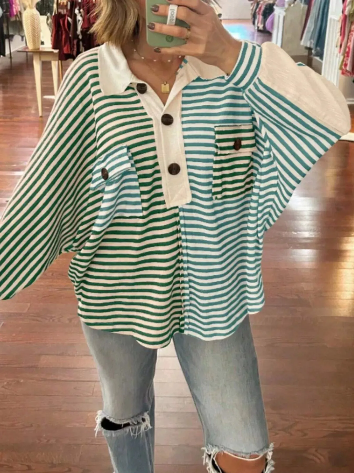 Striped Oversized Half Button Sweatshirt sold by Charming Charlie