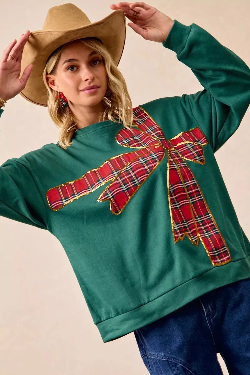 BiBi Plaid Ribbon Bow Detail Christmas Fleece Pullover sold by Charming Charlie product image thumbnail 2