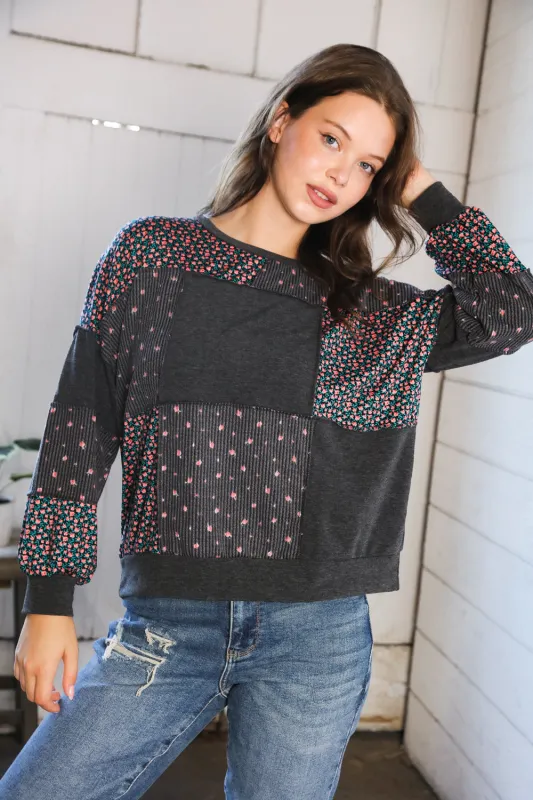 Lazy Daisies Charcoal Pullover sold by Charming Charlie