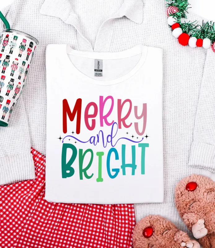 Merry and Bright Graphic Tee and Sweatshirt sold by Charming Charlie