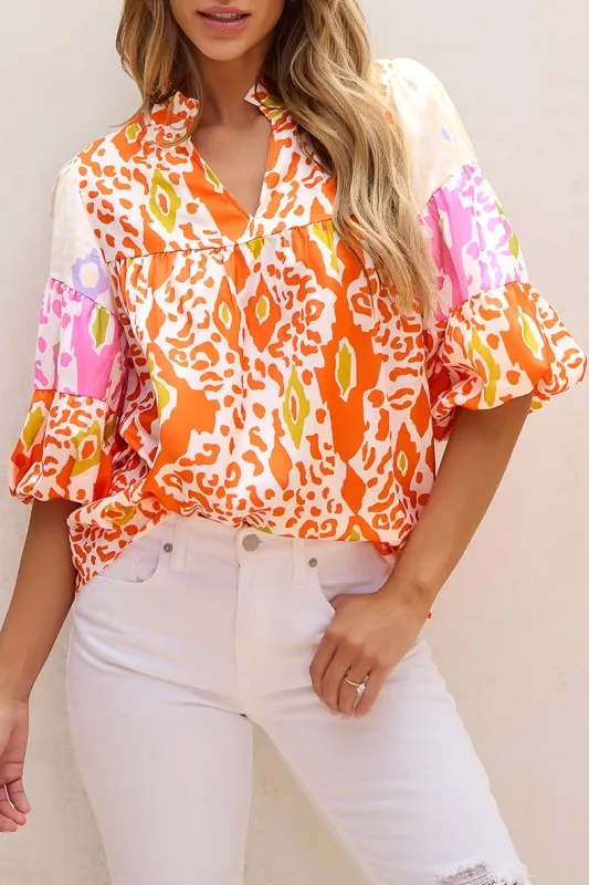 Leopard Colorblock Puff Sleeve Split Neck Blouse sold by Charming Charlie
