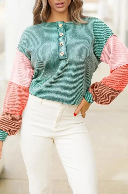 Colorblock Corded Knit Long Sleeve Henley Top sold by Charming Charlie
