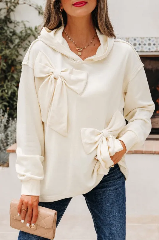Solid Bow Long Sleeve Hoodie sold by Charming Charlie
