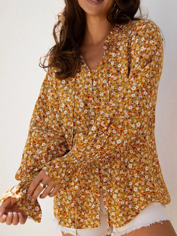 Floral Ruffled Bubble Sleeve Tie Neck Blouse sold by Charming Charlie