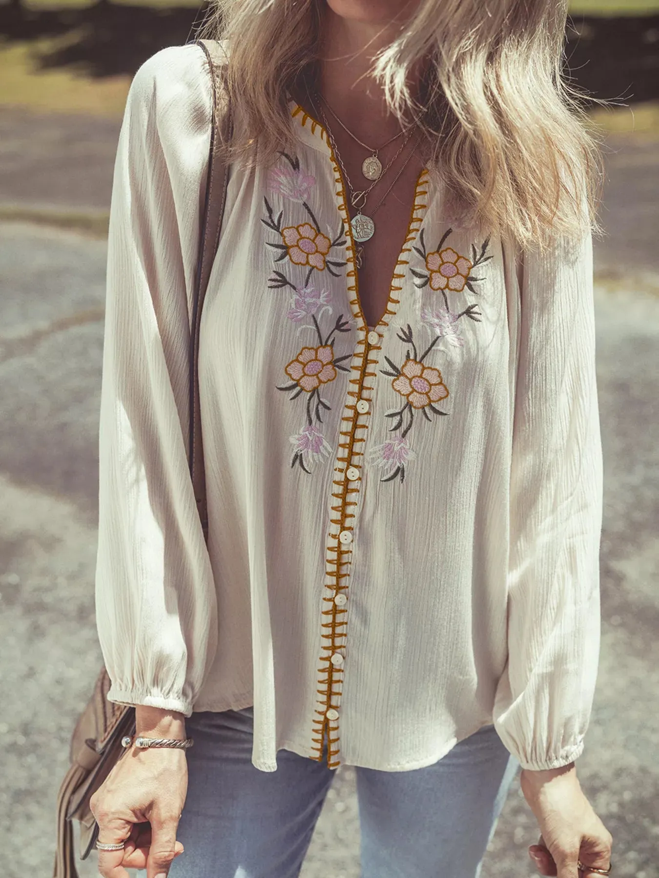 Floral Embroidered Textured Puff Sleeve Loose Shirt sold by Charming Charlie