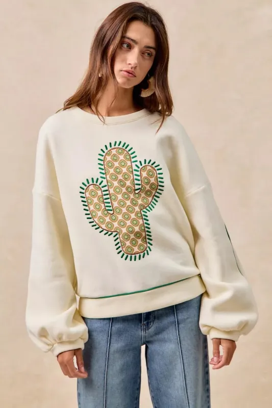 BiBi Cactus Embroidered Fleece Sweatshirt sold by Charming Charlie
