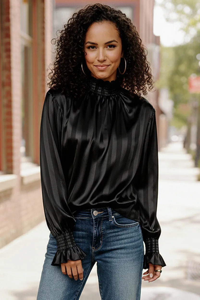 The Satin Scene High Neck Blouse sold by Charming Charlie
