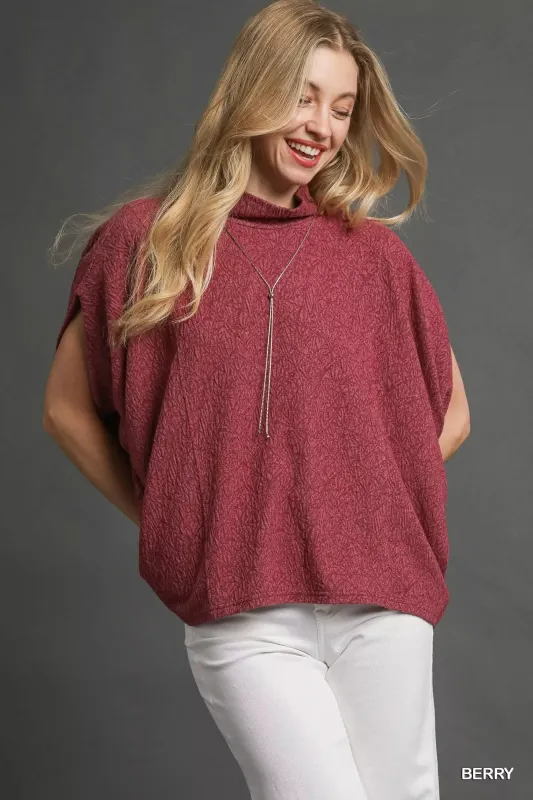 Umgee Textured Mock Neck Relaxed Top sold by Charming Charlie