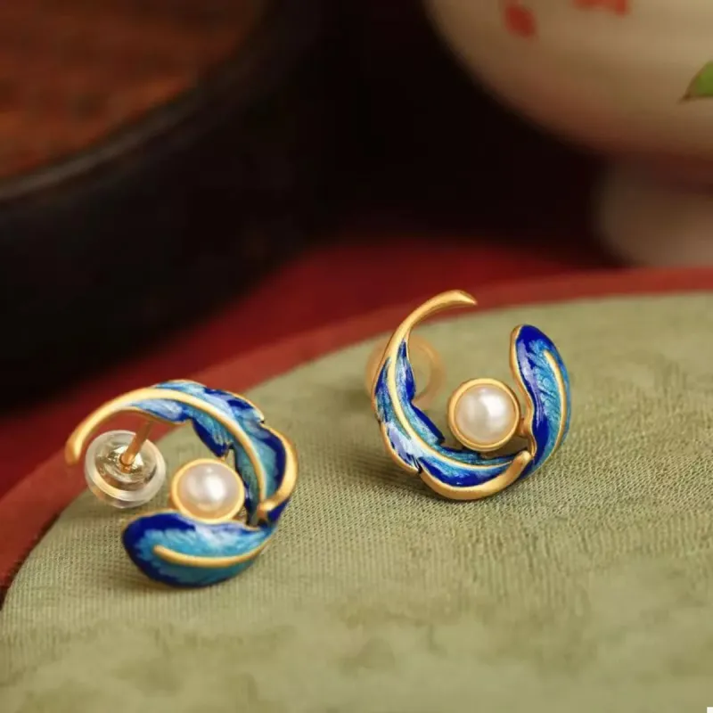 Feather Pearl Stud Earrings sold by Charming Charlie