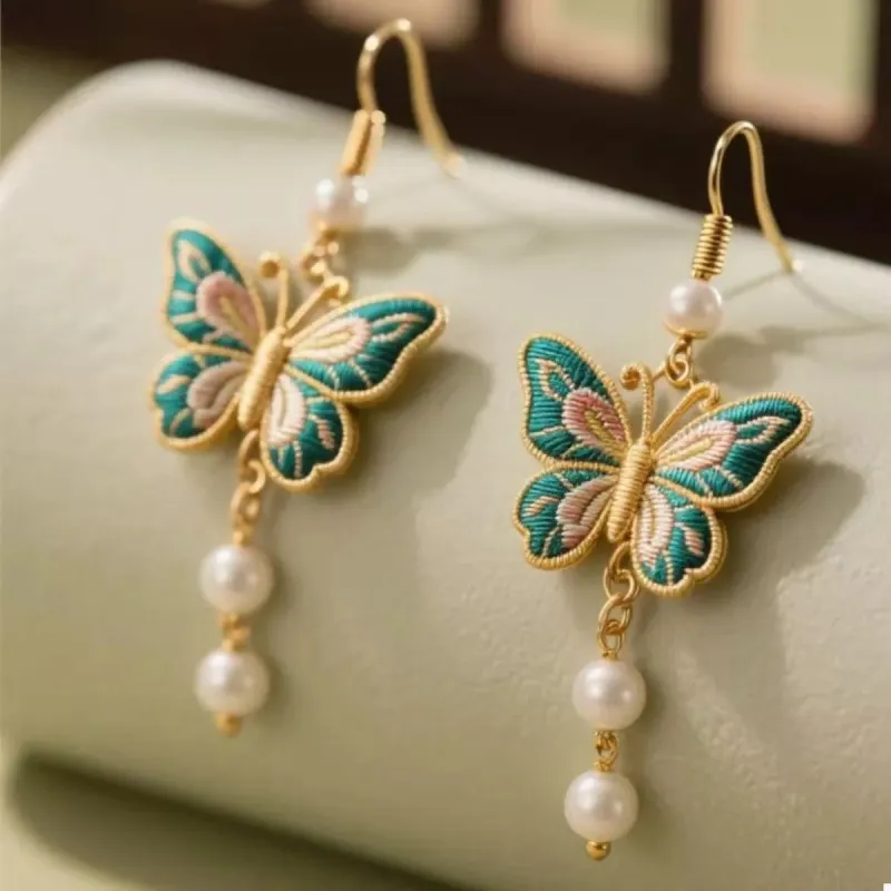 Butterfly Dangle Earrings with Pearls sold by Charming Charlie