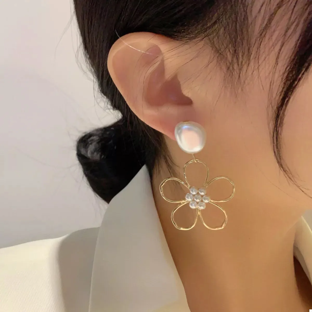 Pearl & Floral Drop Earrings sold by Charming Charlie