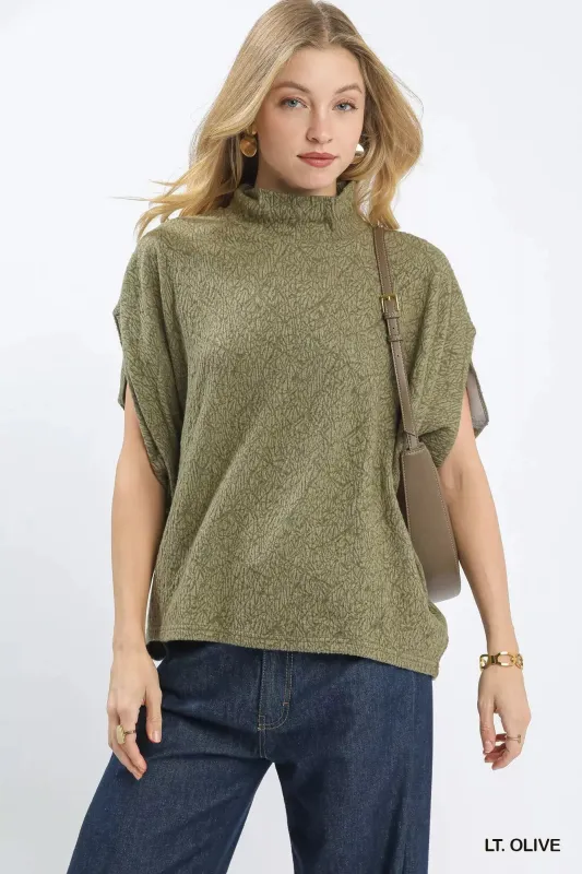 Umgee Textured Mock Neck Relaxed Top sold by Charming Charlie