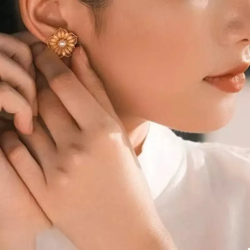 Floral Stud Earrings with Pearl Center sold by Charming Charlie