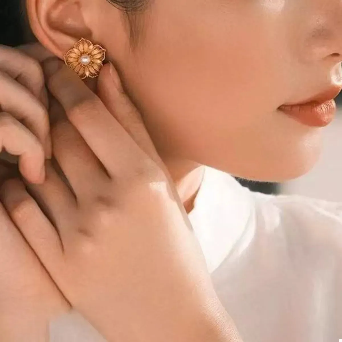 Floral Stud Earrings with Pearl Center sold by Charming Charlie