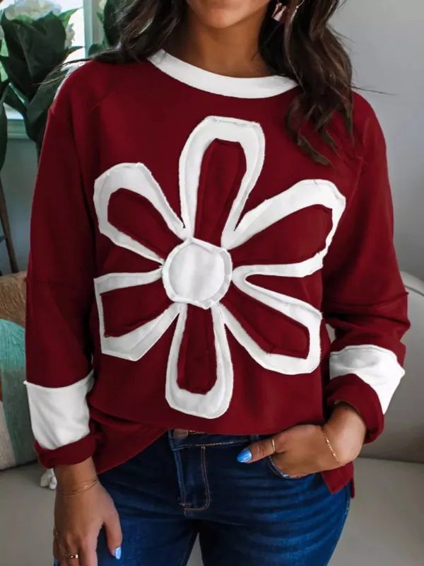 Flower Patched Round Neck Long Sleeve Top sold by Charming Charlie