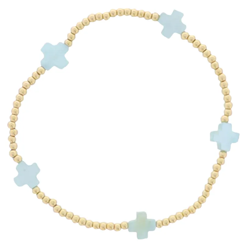 18K Gold Plated Gold Beaded Stretch Bracelet with Blue Square Cross sold by Charming Charlie