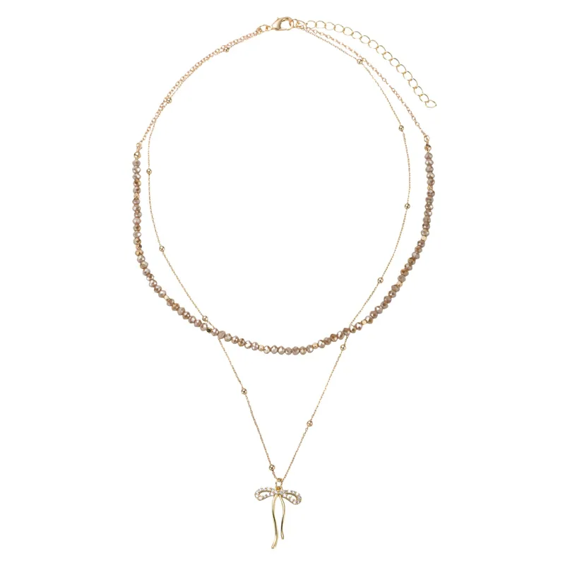 Greige, Gold Beaded 2 Layer Necklace with Gold Bow sold by Charming Charlie