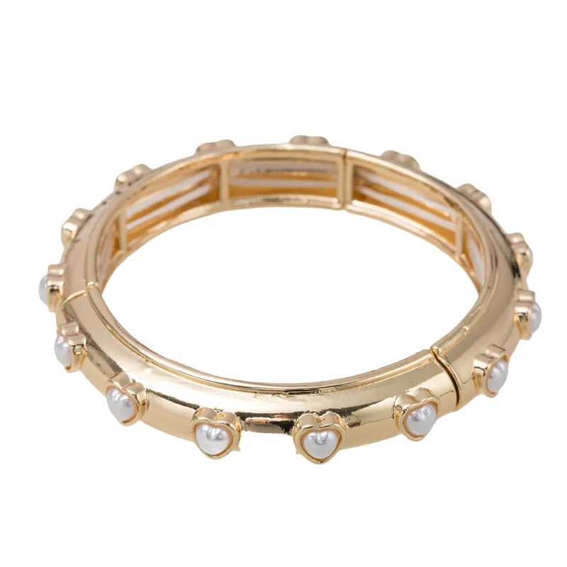 Gold Bangle Bracelet with Pearl Hearts sold by Charming Charlie