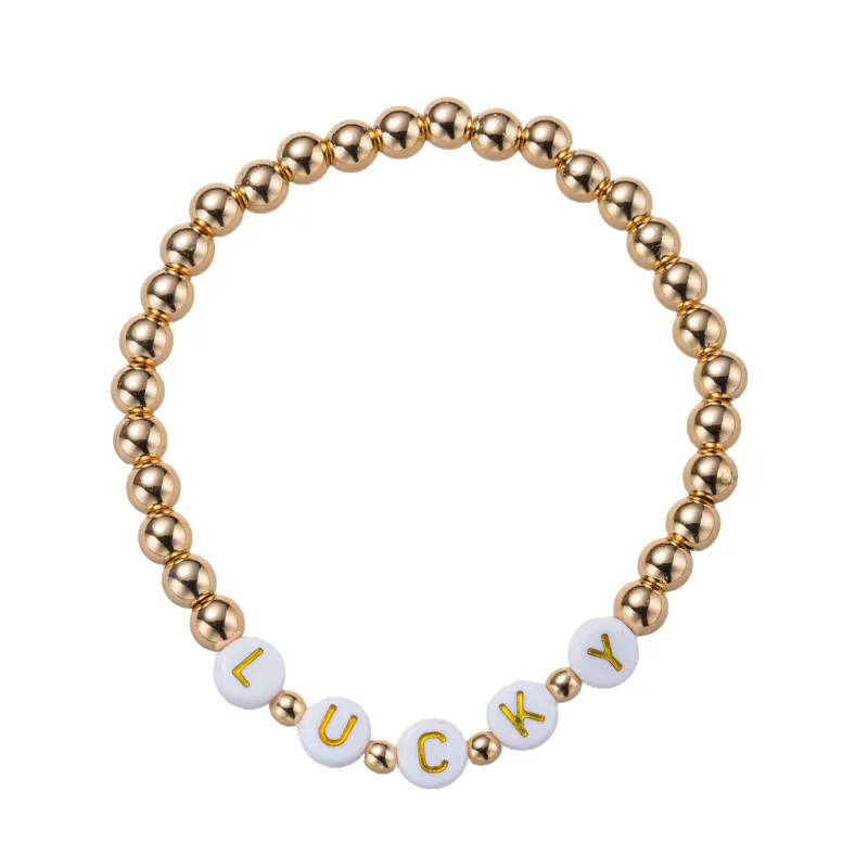 Gold Beaded Stretch Bracelet with "Luck" sold by Charming Charlie