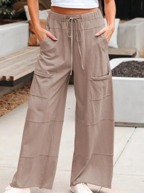 Mineral Wash Exposed Seam Drawstring Elastic Waistband Wide Leg Cargo Pants sold by Charming Charlie
