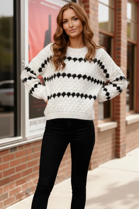 Snowfall Diamonds Black and White Sweater sold by Charming Charlie