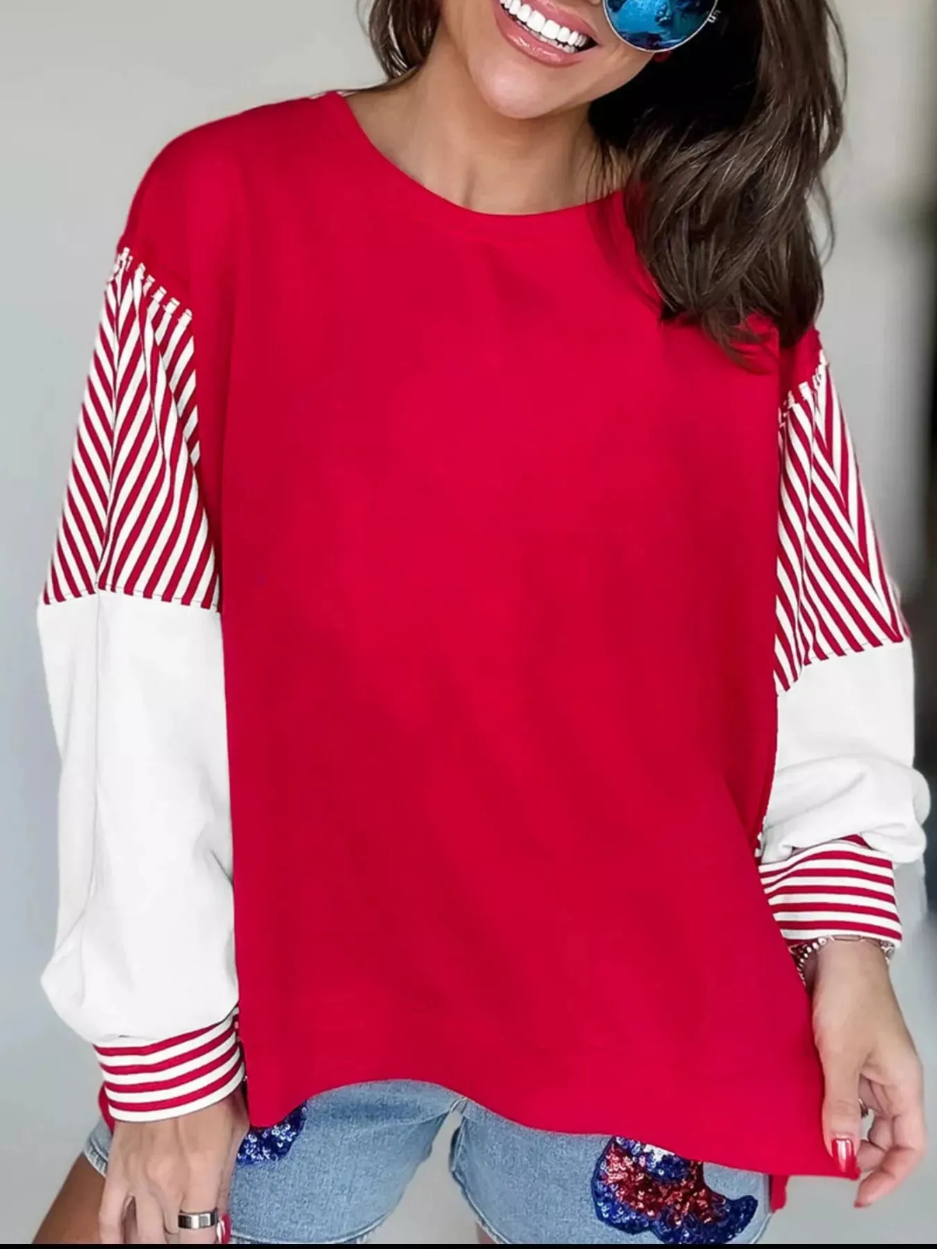 Striped Patchwork Sleeve Colorblock Sweatshirt sold by Charming Charlie