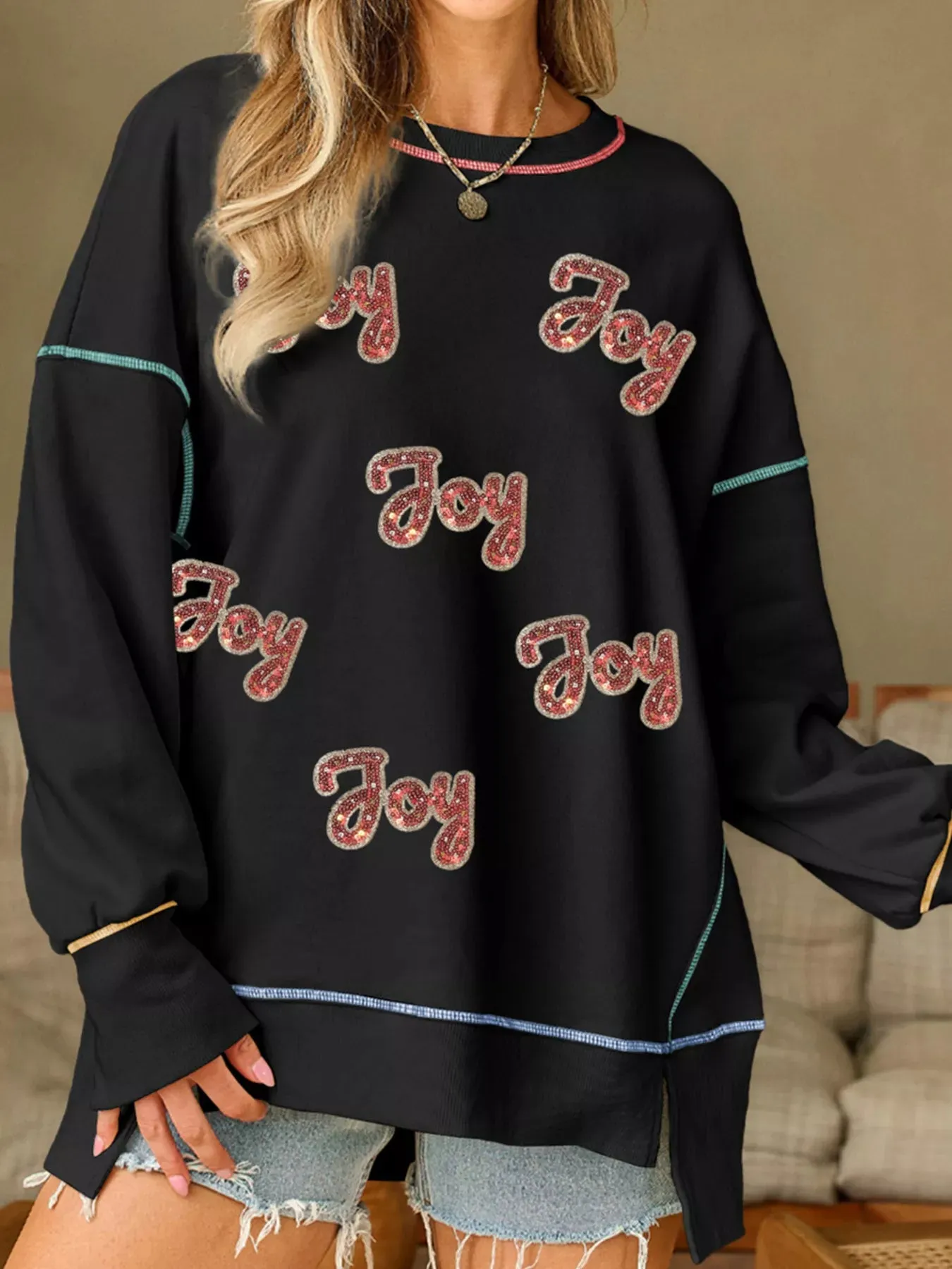 Sequin Joy Letter Graphic Contrast Seam Detail Drop Shoulder Sweatshirt sold by Charming Charlie